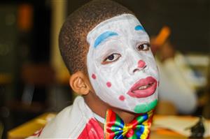 painted clown face kid 